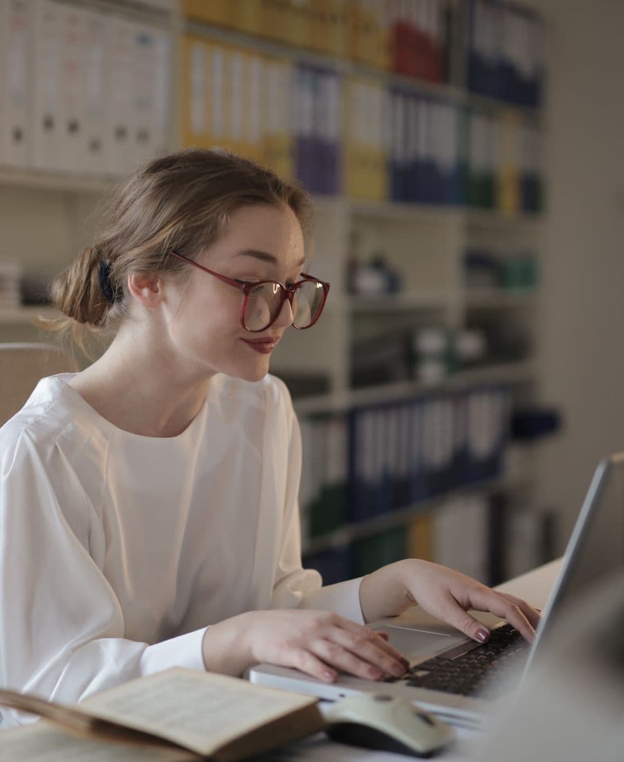 Medical coder working at a laptop
